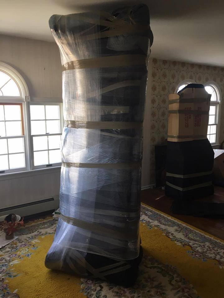 Furniture carefully wrapped with moving pads before a senior move