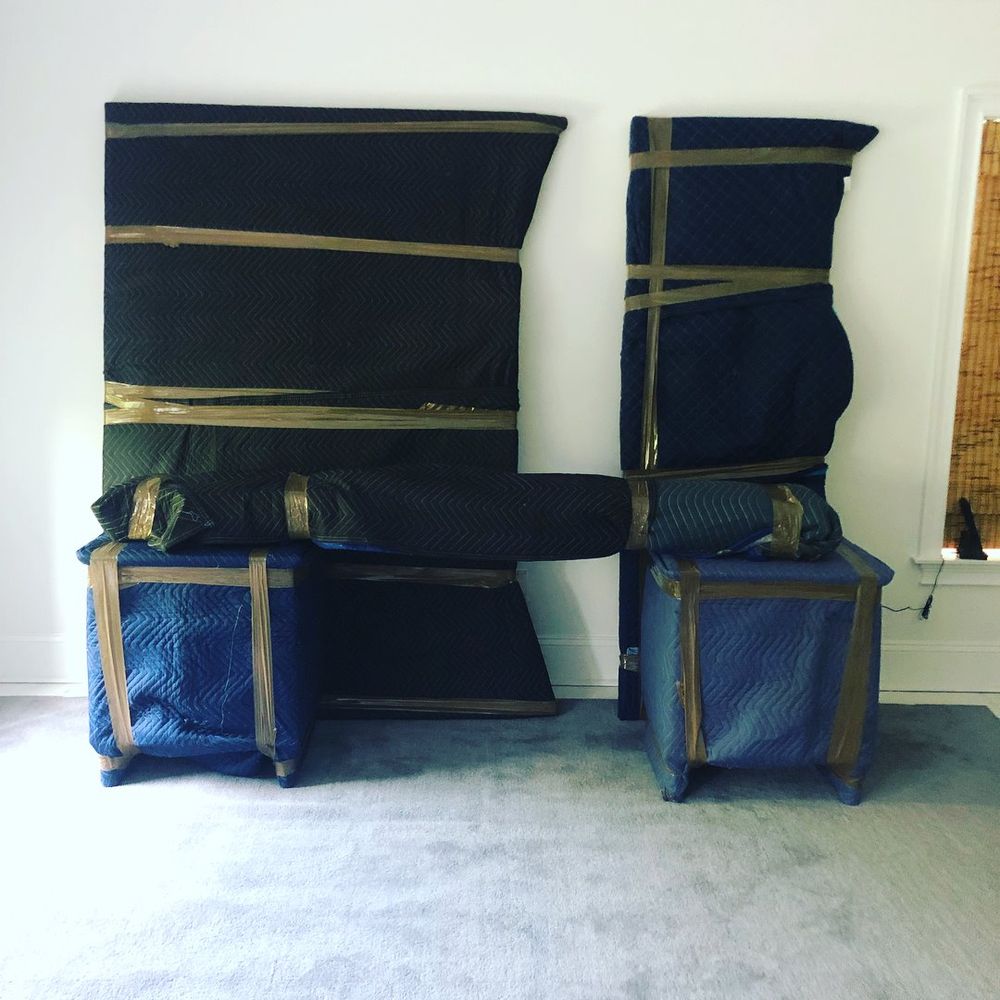 Furniture professionally wrapped with moving pads for a senior move
