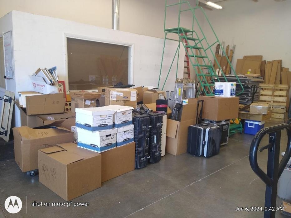 Commercial equipment and boxes staged for an office move