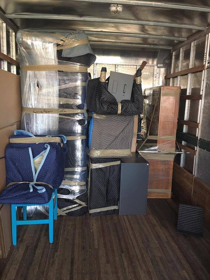 Organized and labeled truck interior on an In or Out Movers job