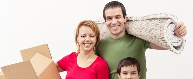 smiling family in the process of moving house